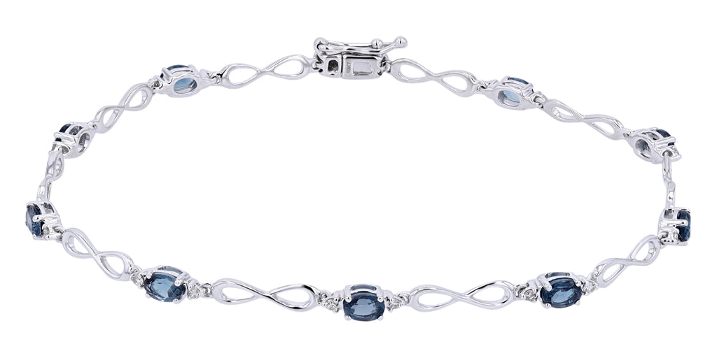 10K White Gold 0.18 CTW Diamond 1.80 CTW London Blue Topaz Infinity Bracelet